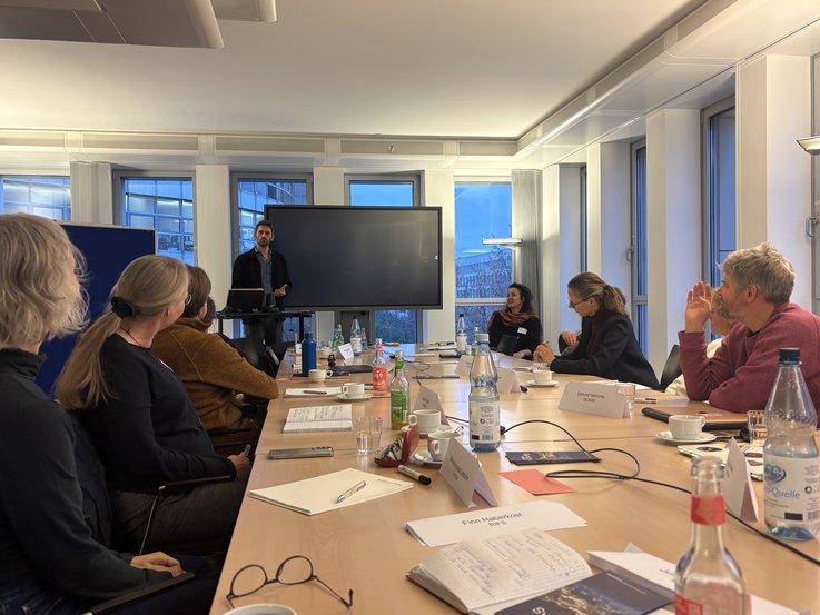 Workshop participants listen to a presentation