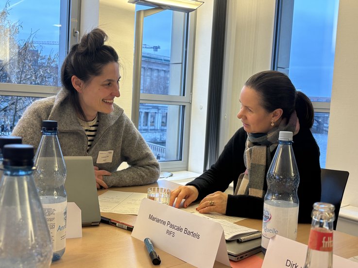 Two workshop participants are discussing